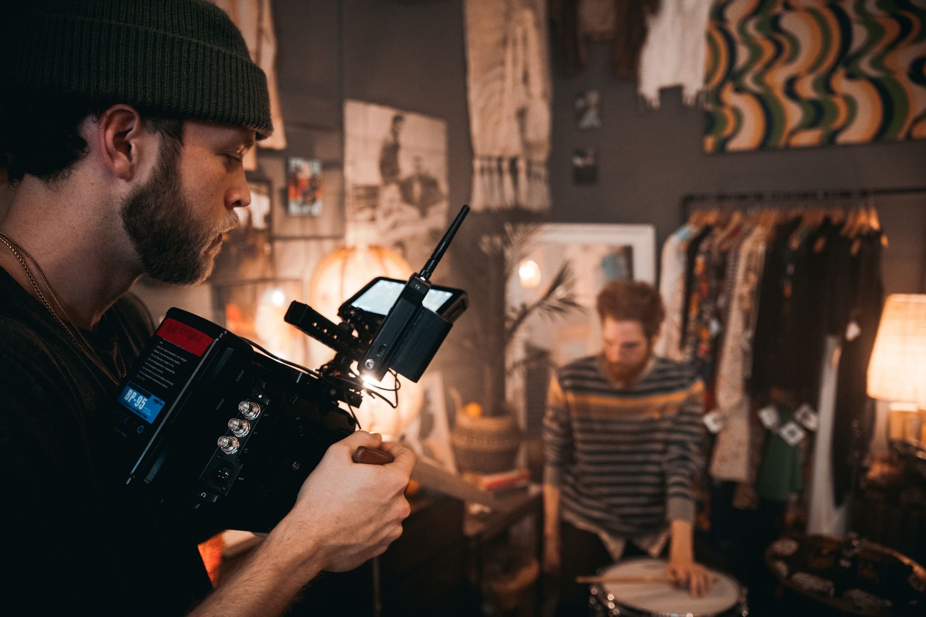 Cinematographer using camera equipment during a film shoot