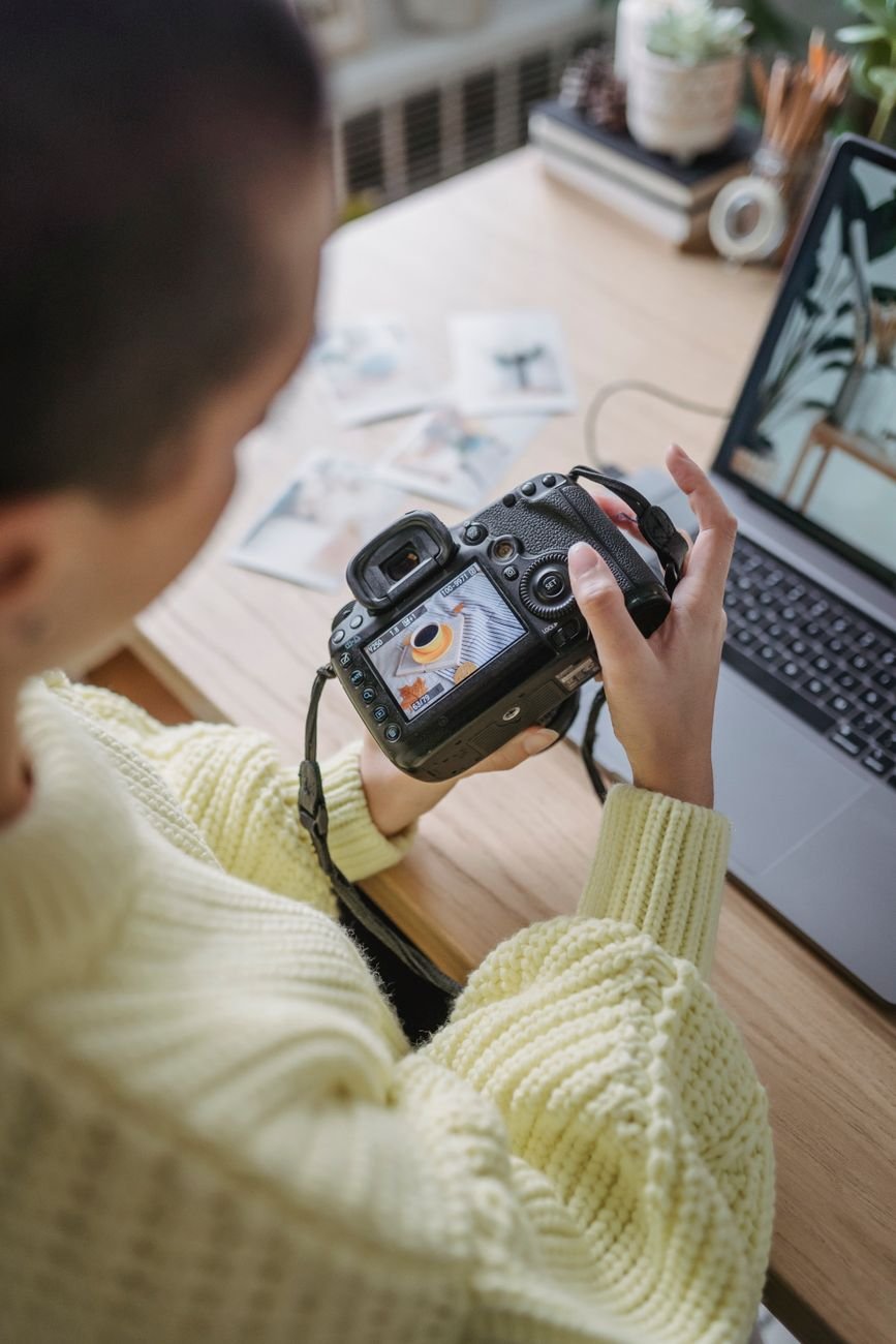 Photographer reviewing their work on a laptop
